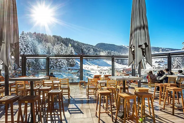 a restaurant with a balcony in Borovets, Bulgaria