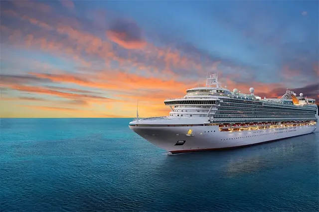 a cruise ship sailing at dusk