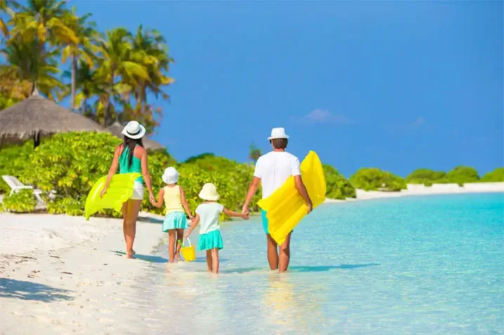 a family walking along a beach