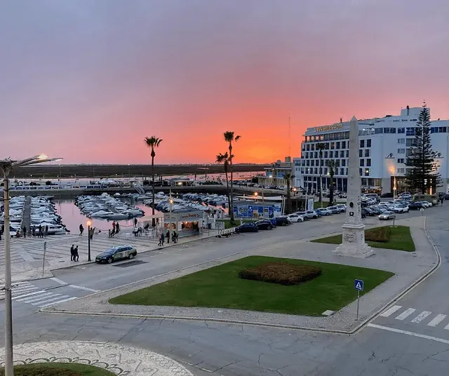 sunset over the marina in faro, portugal