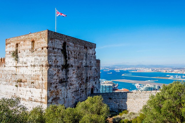 A castle tower overlooking a bay