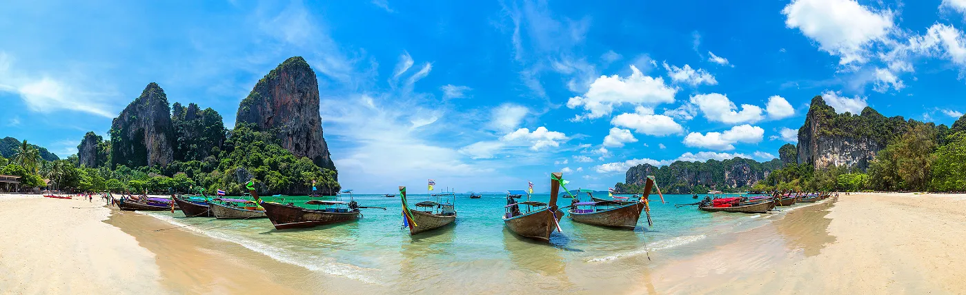 a panoramic picture of a beach in Thailand looking out to a bay