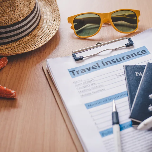 travel insurance documents on a table