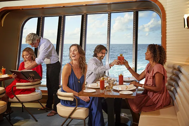 people dining in the wake restaurant on virgin voyages